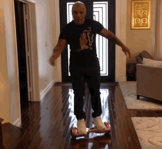 Watch Mike Tyson Bust His Ass Trying to Ride a Hoverboard
